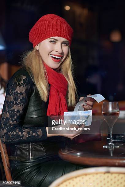 woman in restaurant paying the bill - twenty euro note stock pictures, royalty-free photos & images