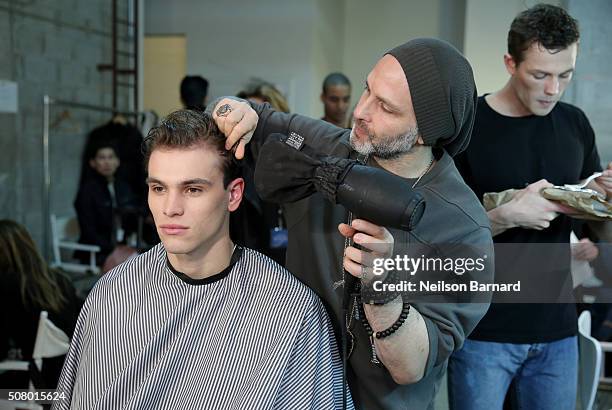 Model prepares backstage at the Nautica Men's Fall 2016 fashion show during New York Fashion Week Men's Fall/Winter 2016 at Skylight Modern on...