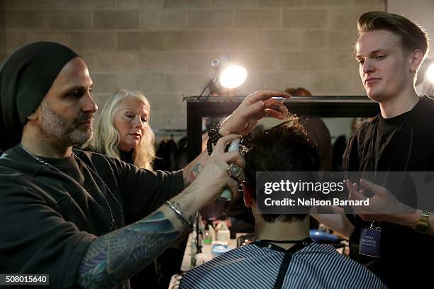 Model prepares backstage at the Nautica Men's Fall 2016 fashion show during New York Fashion Week Men's Fall/Winter 2016 at Skylight Modern on...