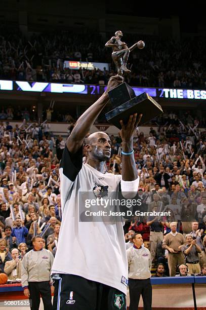 Kevin Garnett#21 of the Minnesota Timberwolves receives the NBA MVP award on May 4, 2004 at the Target Center in Minneapolis, Minnesota. NOTE TO...