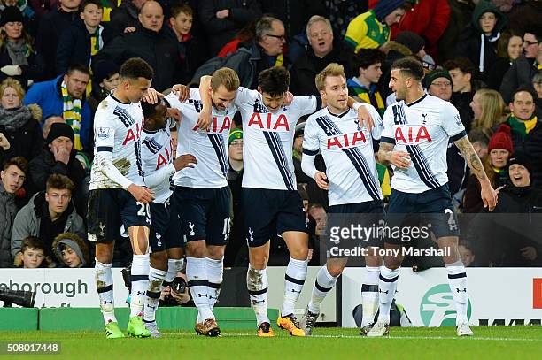 Harry Kane of Tottenham Hotspur celebrates scoring his team's second goal with his team mates during the Barclays Premier League match between...