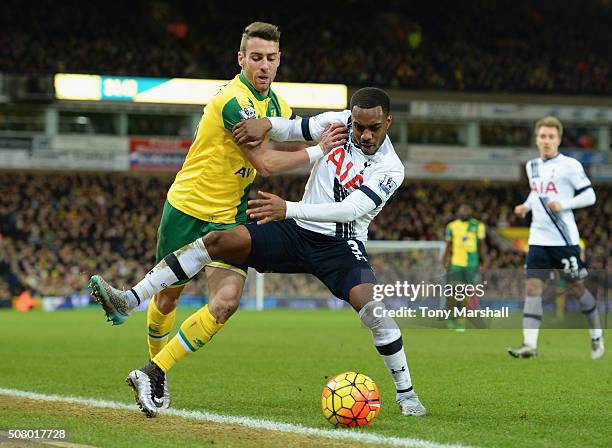 Danny Rose of Tottenham Hotspur controls the ball under pressure of Ivo Pinto of Norwich City during the Barclays Premier League match between...