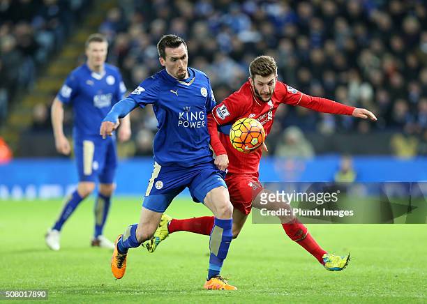 Christian Fuchs of Leicester City in action with Adam Lallana of Liverpool during the Barclays Premier League match between Leicester City and...