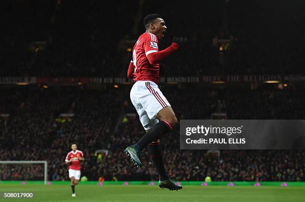 Manchester United's French striker Anthony Martial celebrates scoring their second goal during the English Premier League football match between...