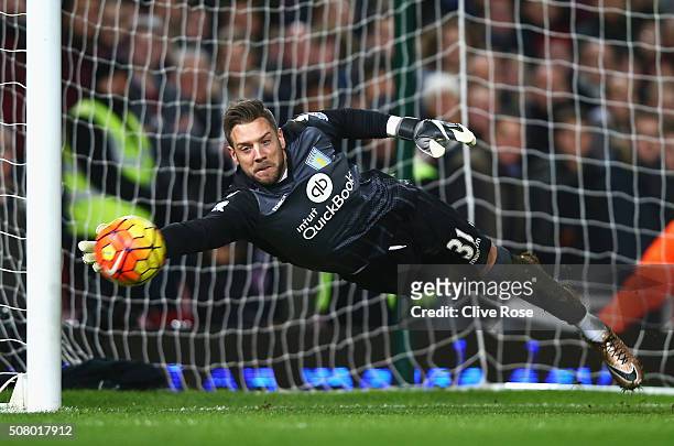 Mark Bunn of Aston Villa makes a save during the Barclays Premier League match between West Ham United and Aston Villa at the Boleyn Ground on...