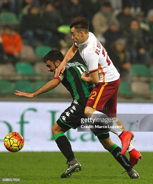 Francesco Magnanelli of US Sassuolo Calcio competes for the ball with Stephan El Shaarawy of AS Roma during the Serie A match between US Sassuolo...
