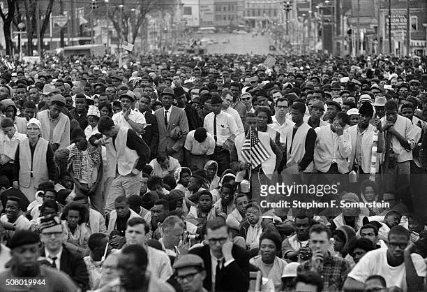 View of the crowd listening to a speech by Dr. Martin Luther King, Jr. During the Selma to Montgomery civil rights March on March 25, 1965 in...