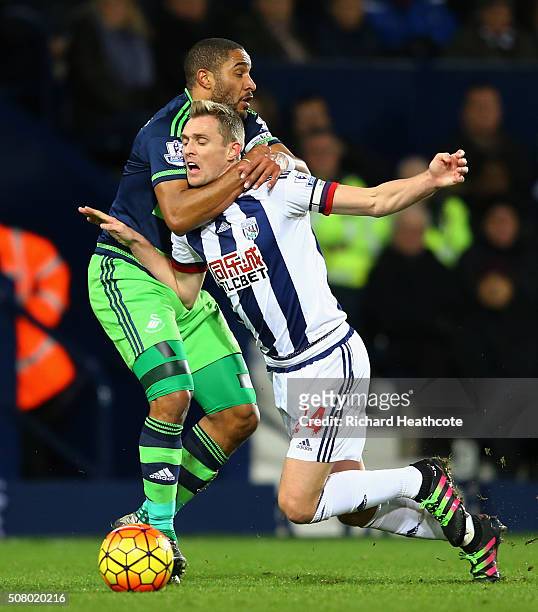 Darren Fletcher of West Bromwich Albion is challenged by Ashley Williams of Swansea City during the Barclays Premier League match between West...