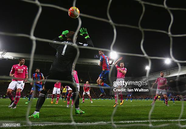 Scott Dann of Crystal Palace scores his team's first goal past Artur Boruc of Bournemouth during the Barclays Premier League match between Crystal...