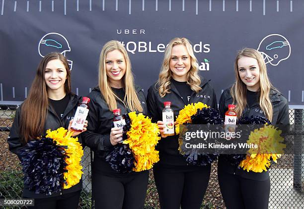 Cheerleaders holding Bai drinks attend "QB Legends On Demand" presented by Uber and Bai at Raymond Kimbell Playground on February 2, 2016 in San...