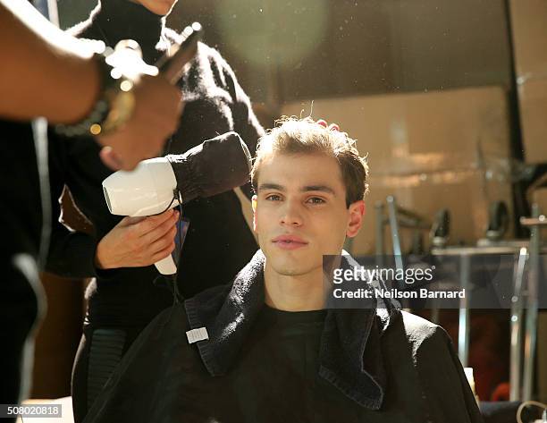 Model prepares backstage at the Nautica Men's Fall 2016 fashion show during New York Fashion Week Men's Fall/Winter 2016 at Skylight Modern on...