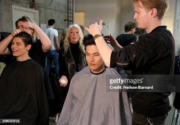 Models prepare backstage at the Nautica Men's Fall 2016 fashion show during New York Fashion Week Men's Fall/Winter 2016 at Skylight Modern on...
