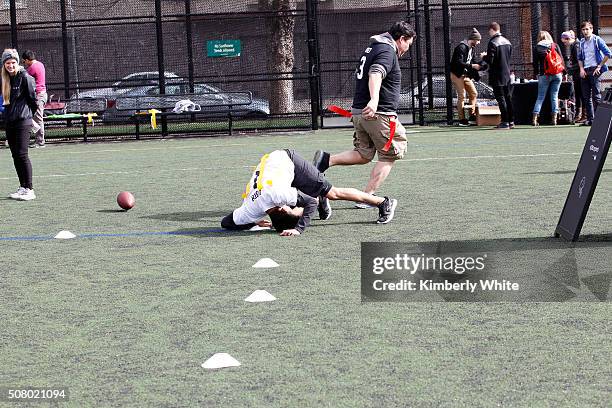 Uber users enjoy a game of flag football during "QB Legends On Demand" presented by Uber and Bai at Raymond Kimbell Playground on February 2, 2016 in...