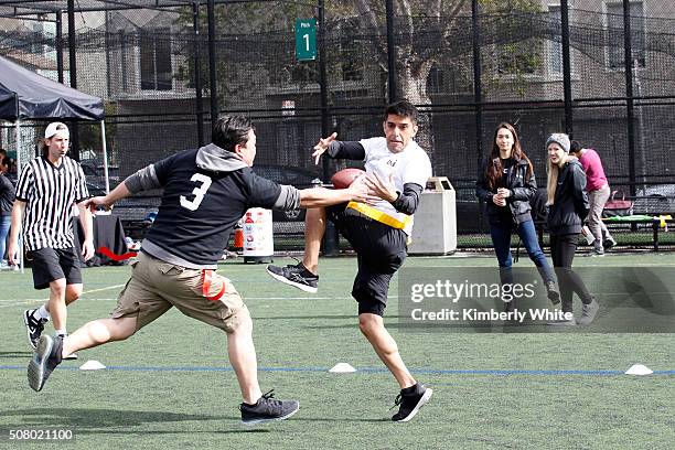 Uber users enjoy a game of flag football during "QB Legends On Demand" presented by Uber and Bai at Raymond Kimbell Playground on February 2, 2016 in...