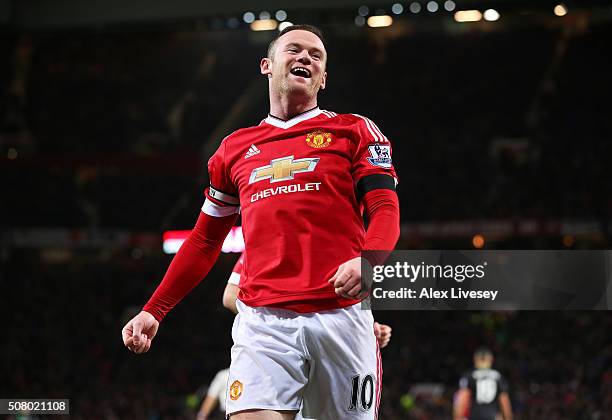 Wayne Rooney of Manchester United celebrates scoring his team's third goal during the Barclays Premier League match between Manchester United and...