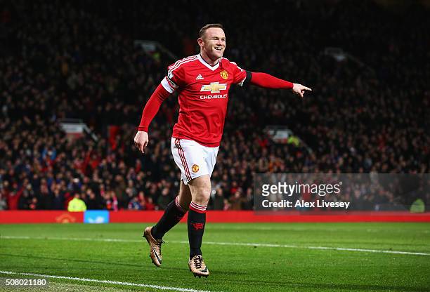 Wayne Rooney of Manchester United celebrates scoring his team's third goal during the Barclays Premier League match between Manchester United and...
