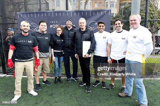 Former NFL quarterback Trent Dilfer and former NFL quarterback Joe Montana pose with Uber users at "QB Legends On Demand" presented by Uber and Bai...