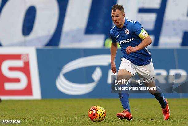 Tobias Jaenicke of Rostock runs with the ball during the third league match between FC Hansa Rostock and VFL Osnabrueck at Ostseestadion on January...