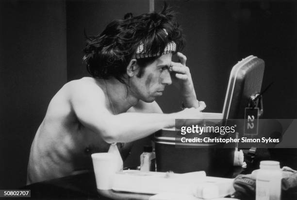 Keith Richards gets ready for a show during the Rolling Stones Tour of the Americas, 1975.