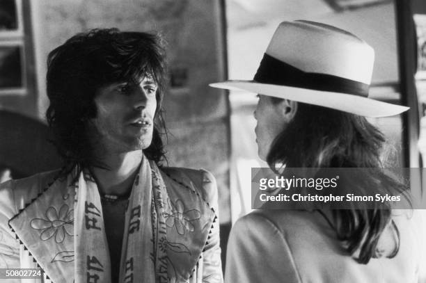 Guitarist Keith Richards with German actress Uschi Obermaier during the Rolling Stones Tour of the Americas, 1975.