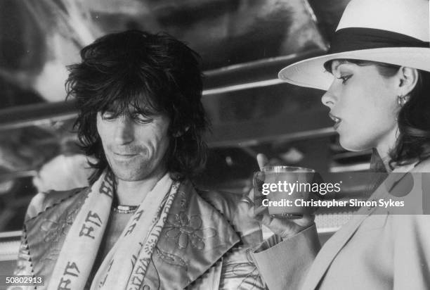 Guitarist Keith Richards with German actress Uschi Obermaier during the Rolling Stones' 1975 Tour of the Americas.