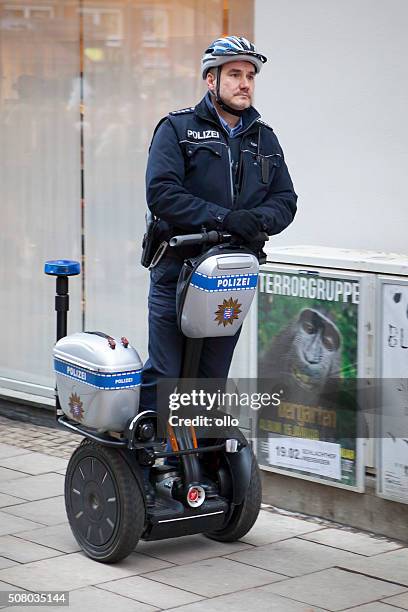 german police officer patrolling on a segway - segway 個照片及圖片檔