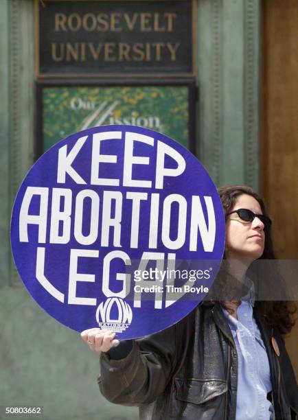Demonstrator Kirsten Daurelio displays her "Keep Abortion Legal" sign during a rally against the Pro-Life Action League outside Roosevelt University...