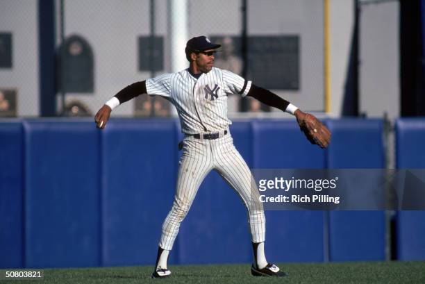 Dave Winfield of the New York Yankees looks to throw the ball during a 1981 season game at Yankee Stadium in the Bronx, New York.