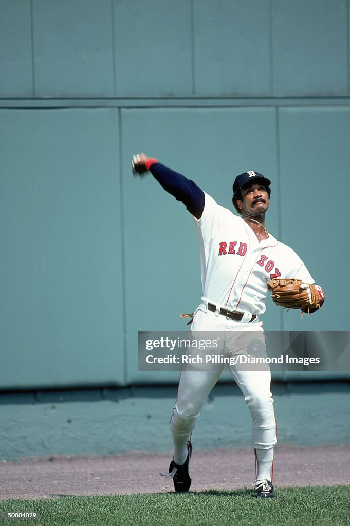Jim Rice Images Jim Rice of the Boston Red Sox throws the ball to the infield during ...