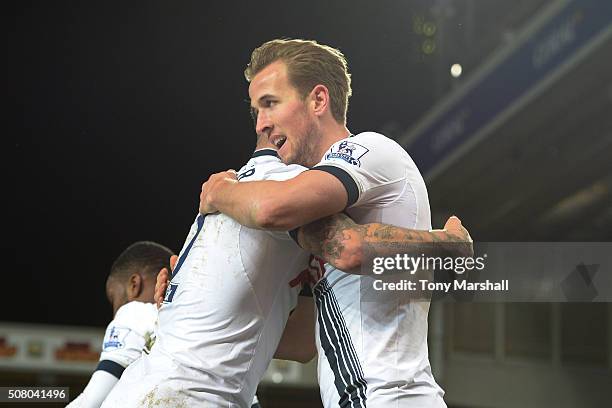 Harry Kane of Tottenham Hotspur celebrates scoring his team's third goal with his team mate Kyle Walker during the Barclays Premier League match...