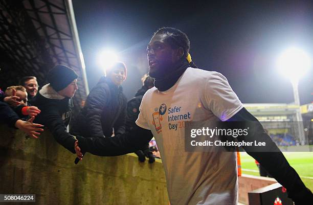 Emmanuel Adebayor of Crystal Palace high fives with fans prior to the Barclays Premier League match between Crystal Palace and A.F.C. Bournemouth at...