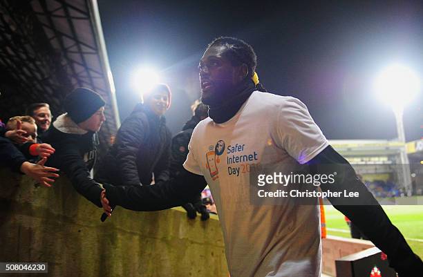 Emmanuel Adebayor of Crystal Palace high fives with Crystal Palace fans prior to the Barclays Premier League match between Crystal Palace and A.F.C....