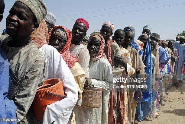 Internally Displaced Persons mostly men queue while waiting to be served with food at Dikwa Camp, in Borno State in north-eastern Nigeria, on...