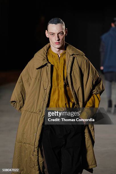 Model walks the runway wearing Robert Geller during New York Fashion Week Men's Fall/Winter 2016 at Skylight at Clarkson Sq on February 2, 2016 in...