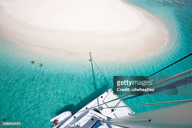 view of sandy spit, bvi from the catamaran's mast - snorkel reef stockfoto's en -beelden