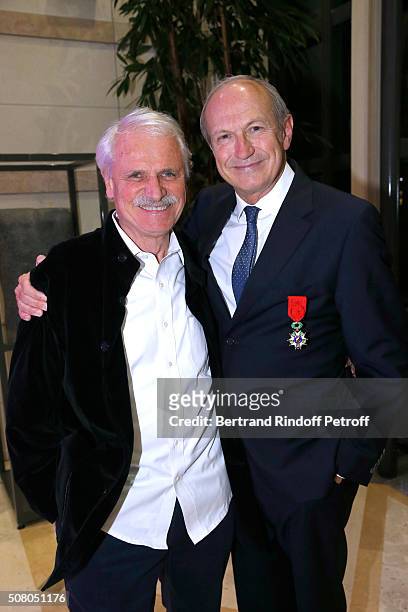 Photographer Yann Arthus-Bertrand and Jean-Paul Agon attend President of l'Oreal Jean-Paul Agon receives Insignia of Officer of the Legion of Honor...