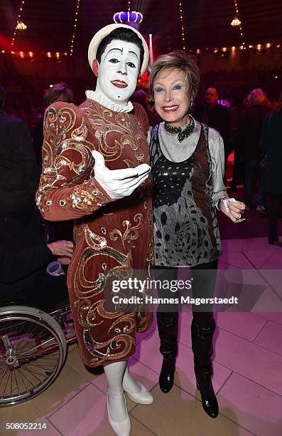 Antje-Katrin Kuehnemann with a clown during the premiere of the Circus Krone program 'Circus der Preistraeger' at Circus Krone on February 2, 2016 in...