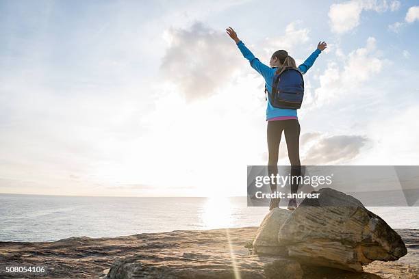 happy hiker reaching the top - mountain peak climb stock pictures, royalty-free photos & images