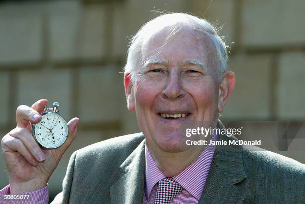 Sir Roger Bannister poses with the original stopwatchthat was used when recording the first sub 4 minute mile on May 6, 2004 at Pembroke College in...