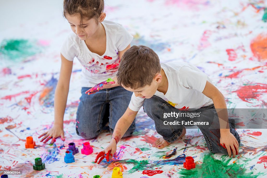 Fun Childhood Finger Painting Brother and Sister