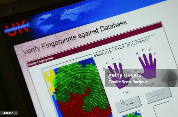 Computer screen displays information after a persons fingerprint was scanned on May 6, 2004 in London, England. Members of the British Home Affairs...