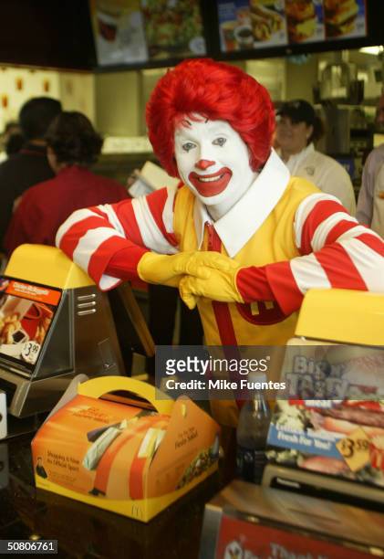 Ronald McDonald smiles with a Happy Meal for adults at a McDonald's restaurant on Thursday May 6, 2004 May 6, 2004 in Dallas, Texas. . The meal,...
