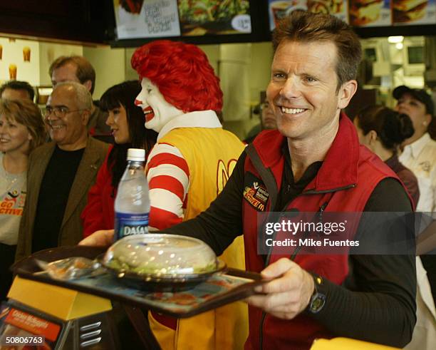 Fitness expert Bob Greene serves a Happy Meal for adults at a Dallas McDonald's restaurant May 6, 2004 in Dallas, Texas. The meal, which features a...