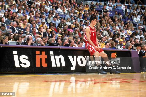 Yao Ming of the Houston Rockets waits to get into Game five of the Western Conference Quarterfinals during the 2004 NBA Playoffs against the Los...