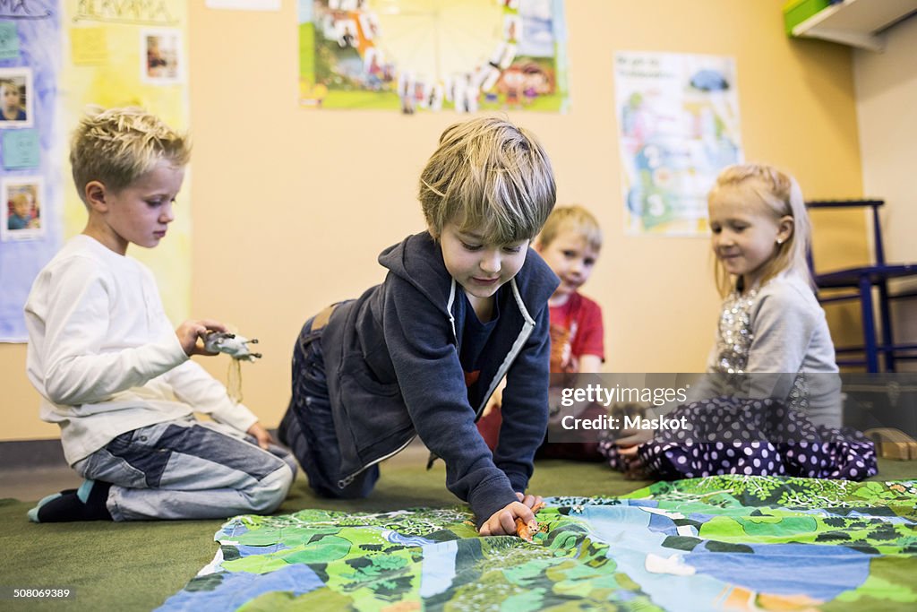 Elementary students playing in kindergarten