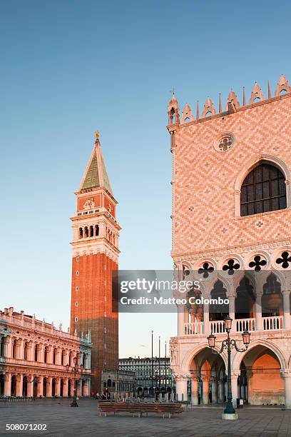 italy, veneto, venice. first light on doges palace and campanile - doge's palace stockfoto's en -beelden