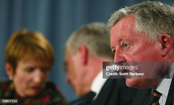 Britain's Culture Secretary Tessa Jowell and Foreign Secretary Jack Straw whisper as David Morgan, Chairman of the England Cricket Board speaks...