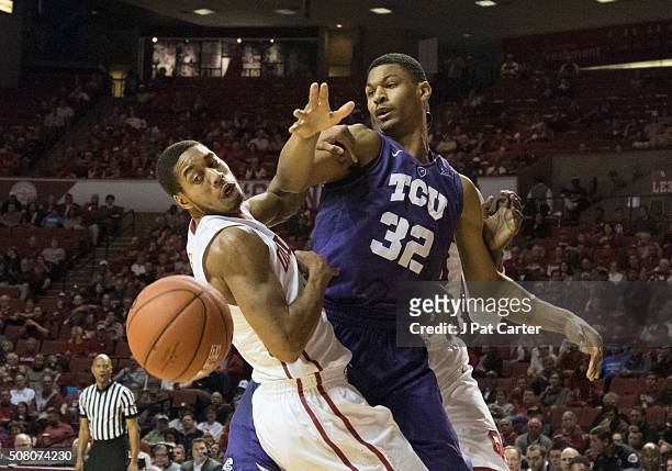 Isaiah Cousins of the Oklahoma Sooners knocks the ball away from Karviar Shepherd of the TCU Horned Frogs during the first half of a NCAA college...