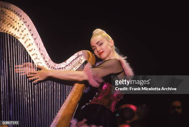Ameican pop singer Madonna performs on stage in Kobe, Japan, April 1990.