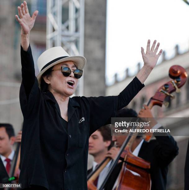 Japanese musician and artist Yoko Ono, widow of John Lennon, dances during an event of the Secretary of Cultura at the Zocalo Square in Mexico City,...
